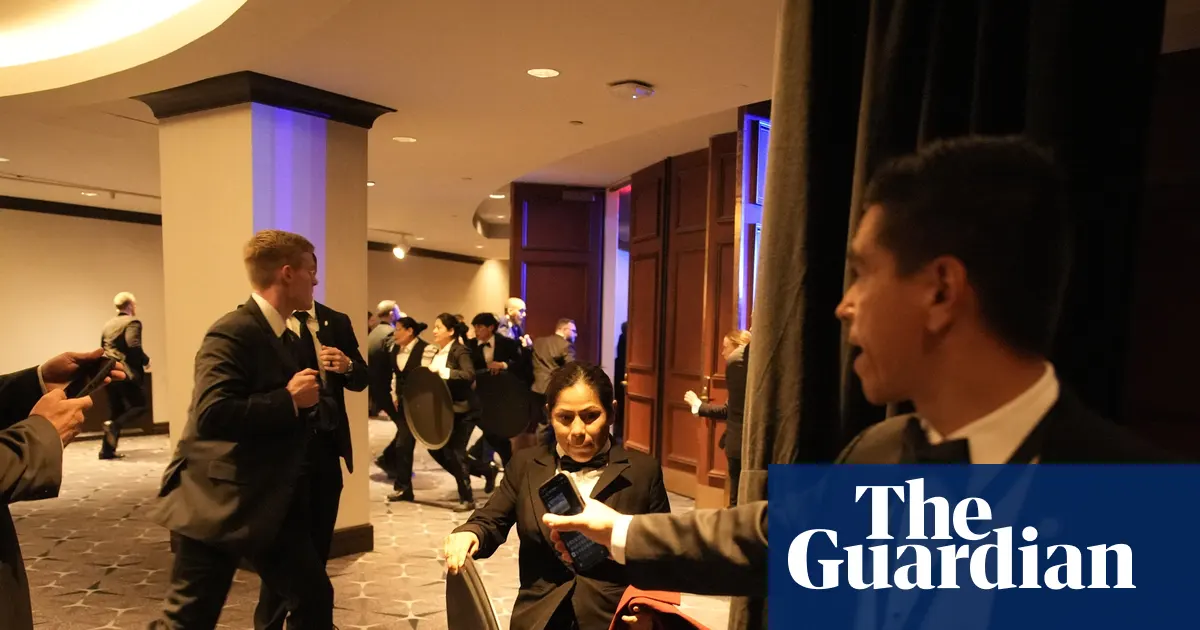 Chaos as Trump whisked from Washington press dinner after shots fired – in pictures