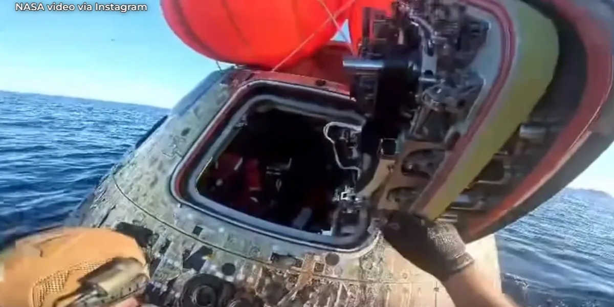 Watch: New video shows Navy divers opening hatch to greet Artemis astronauts