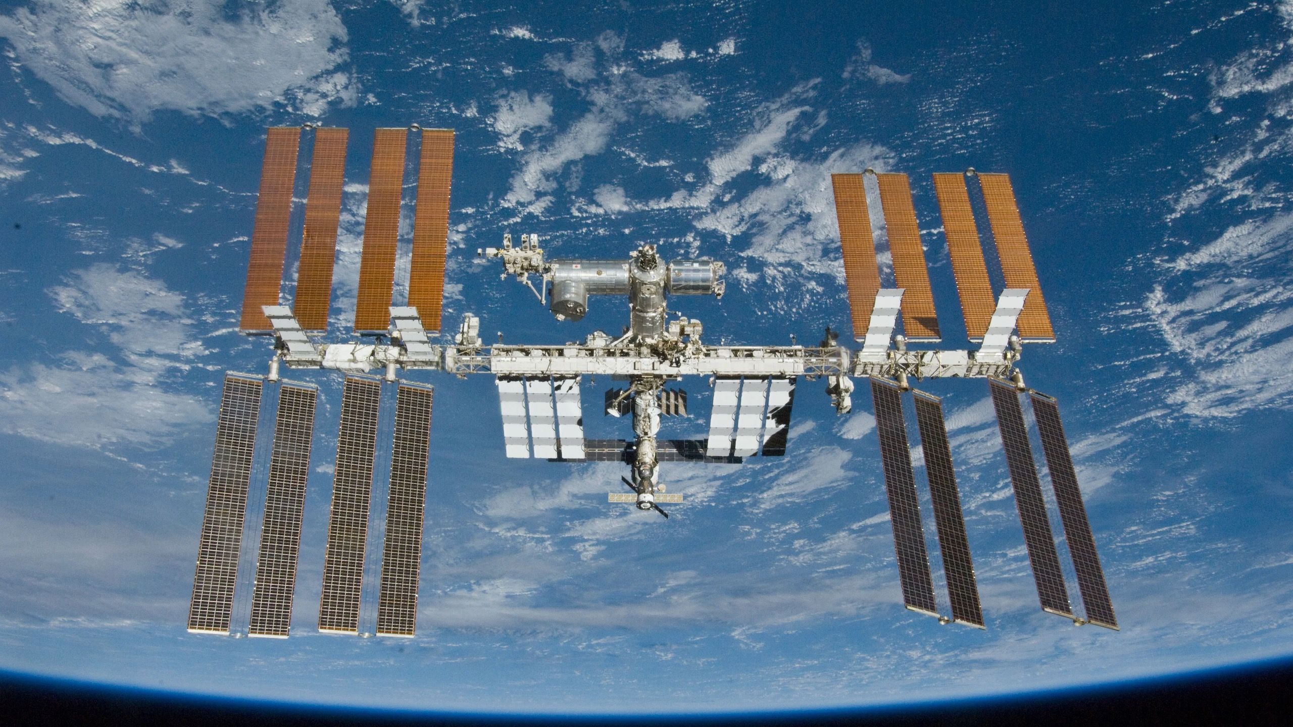 Astronauts on International Space Station take shelter in SpaceX Dragon as cosmonauts try to fix air leak