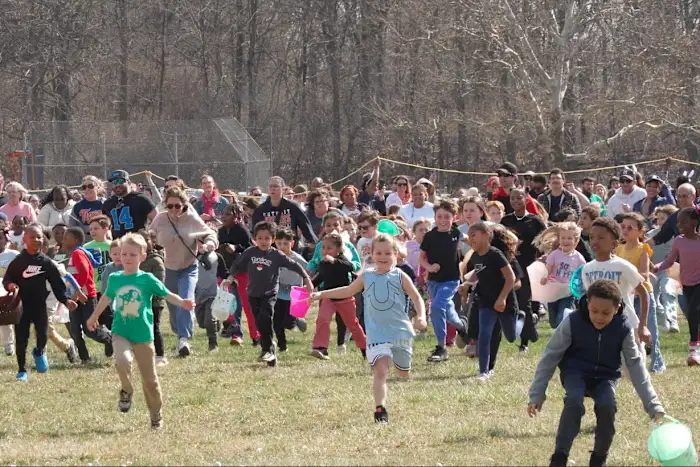 Children race to gather marshmallows dropped from a helicopter at pair ... 