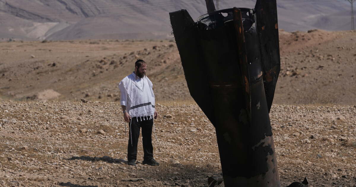 Israel and Iran trade strikes, threatening to drag region back to war
