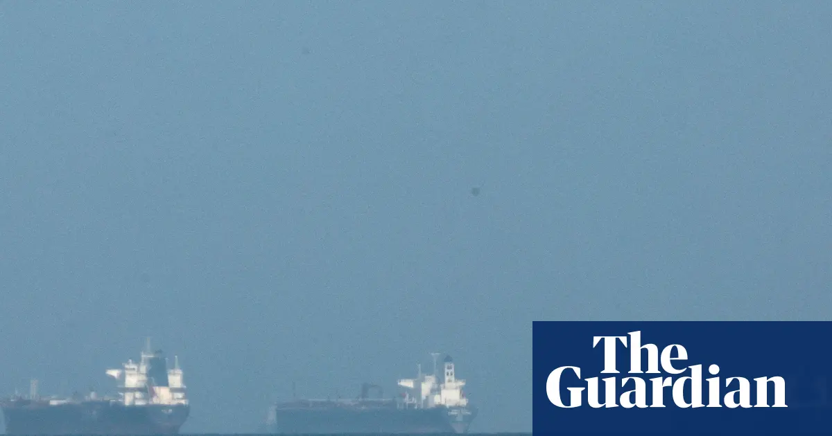 ‘We’re powerless … and hoping nothing hits us’: trapped on a tanker as Iran war escalates