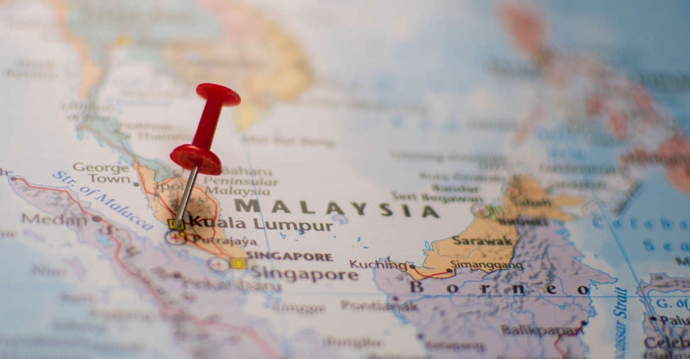 Malaysia searches for 14 missing after migrant boat capsizes