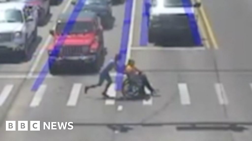 Watch: Driver dressed as Spider-Man whisks man in a wheelchair across busy road