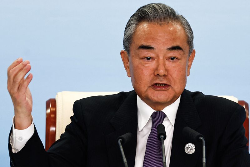 China's foreign minister tells Israeli counterpart that attacks on Iran must end