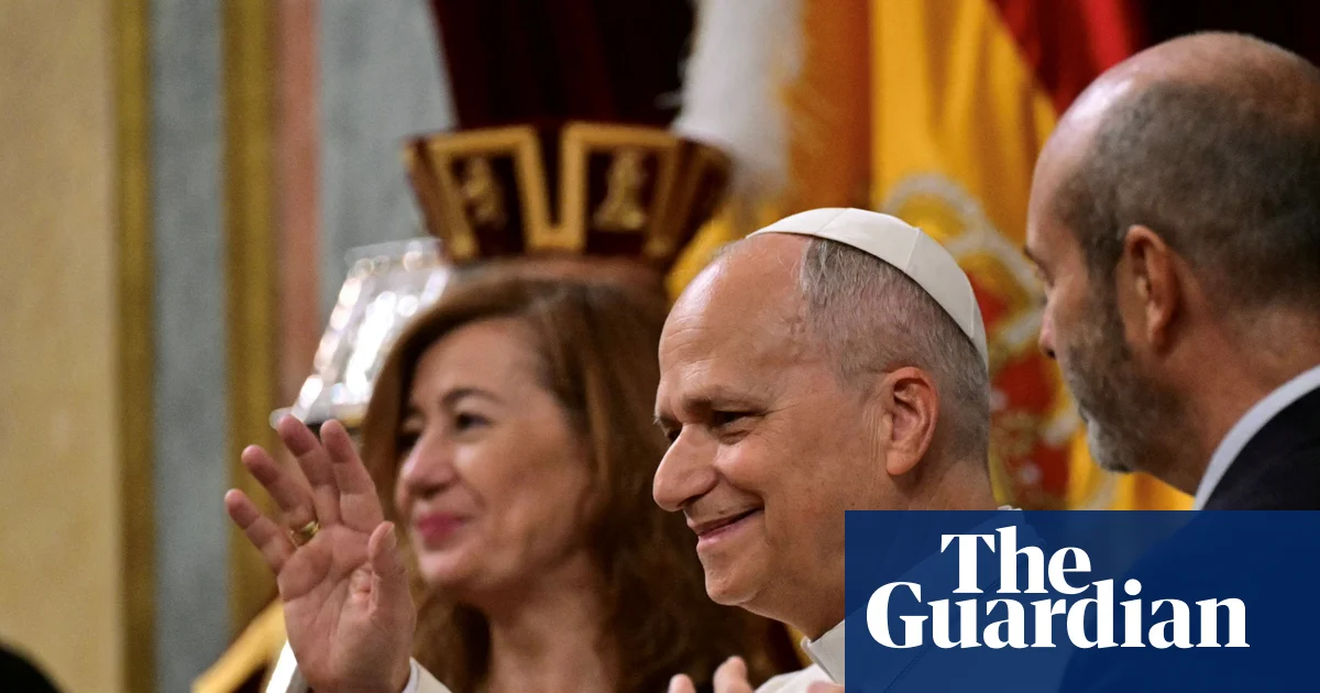 Pope Leo receives standing ovation in rare papal address to Spain’s parliament – video