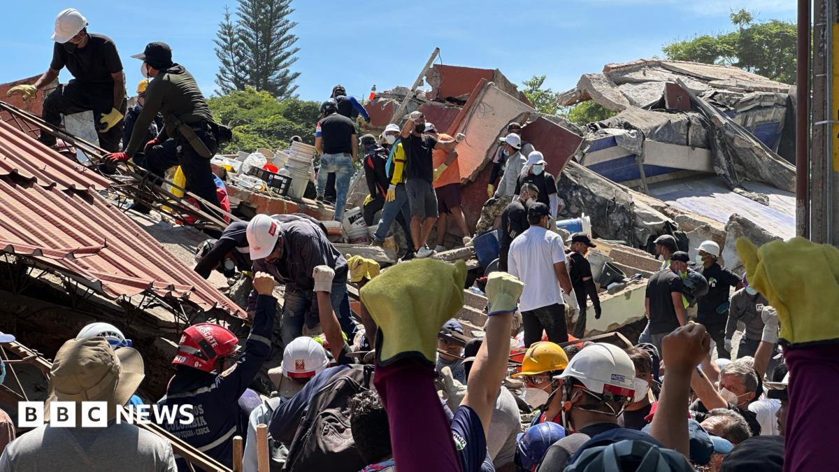 Anguish of Colombian brother at rubble of building being searched for earthquake survivors