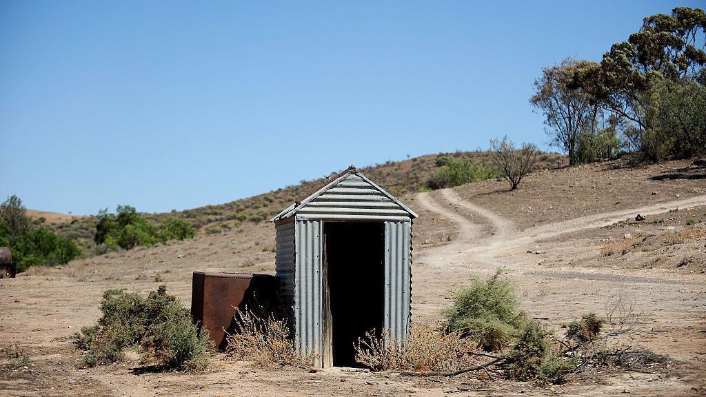 Woman trapped in poo for three hours after outback toilet collapses