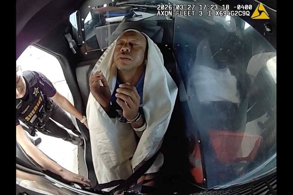 Bodycam shows a stunned Tiger Woods handcuffed after a Florida rollover crash