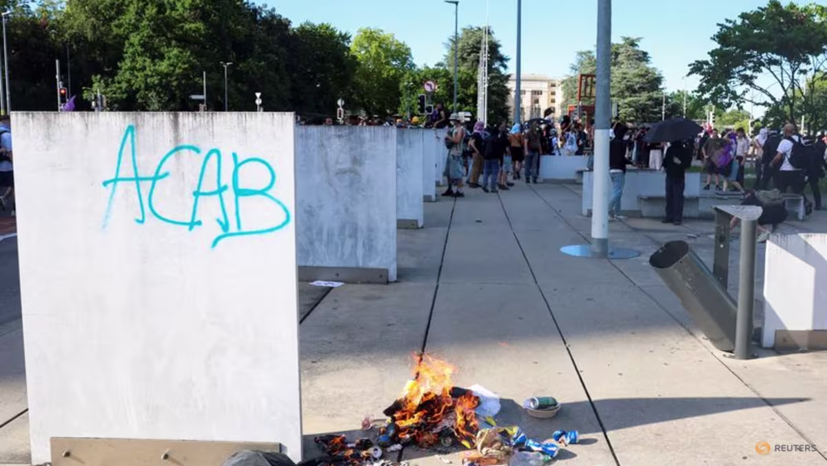 Protesters set Tesla ablaze, smash UN office's windows in Geneva anti-G7 march