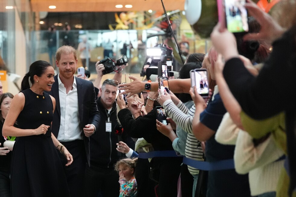 Prince Harry and Meghan arrive in Australia for a low-key, privately funded visit
