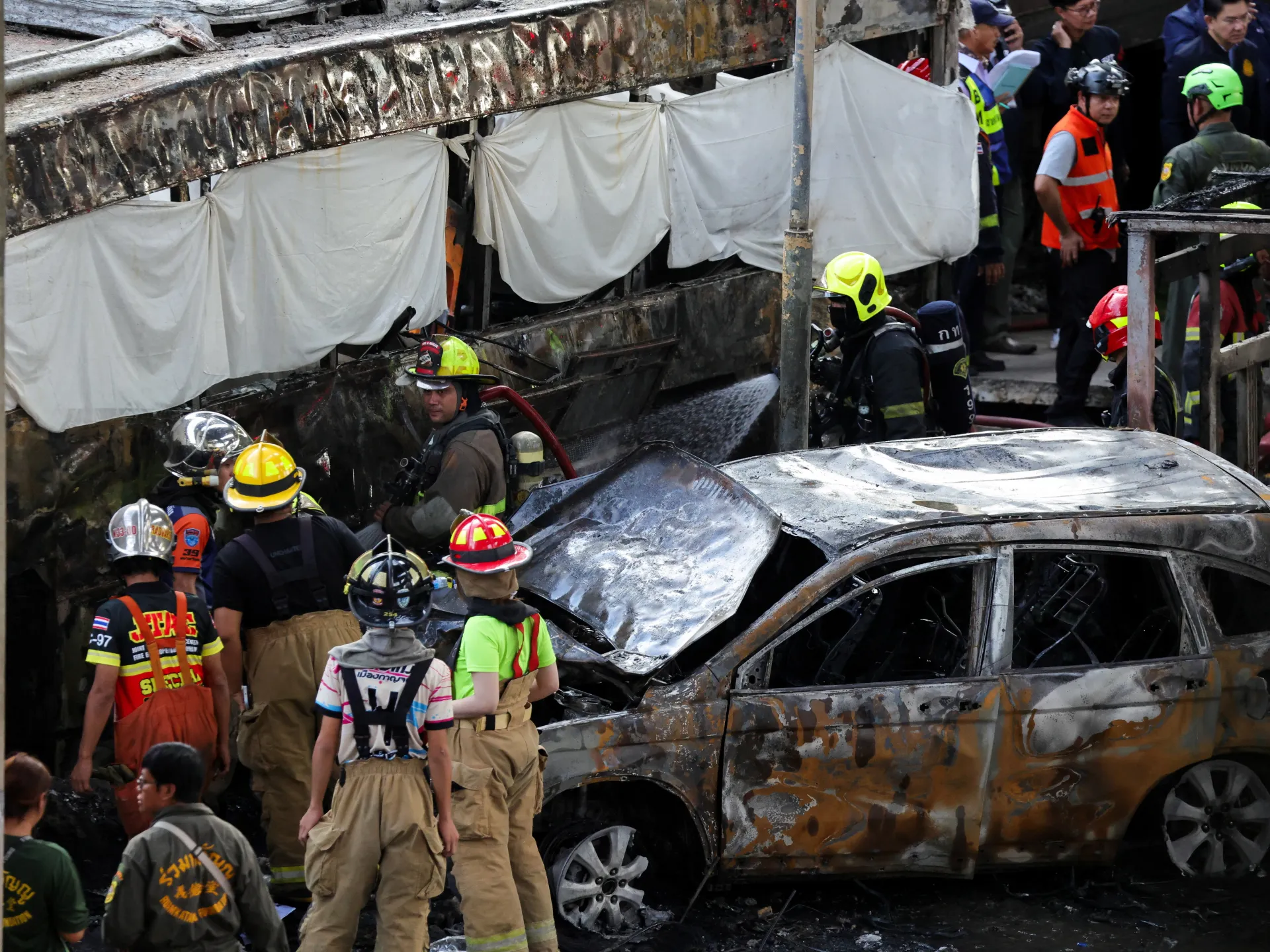 At least eight killed, 35 injured as train hits bus in Bangkok