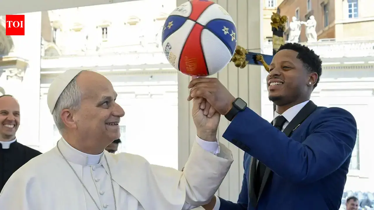 Pope Leo XIV spends quality time with Harlem Globetrotters as he attempts to spin a basketball on his finger
