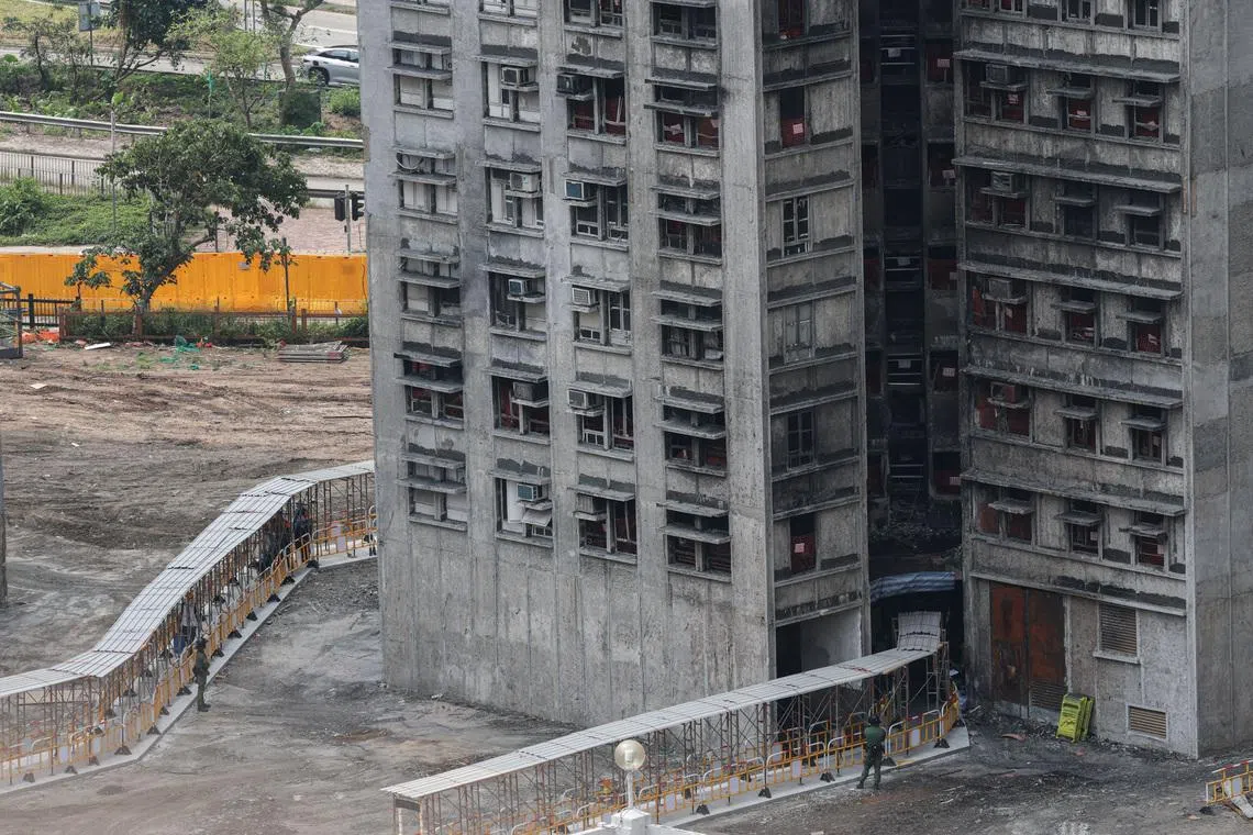 Hong Kong fire victims scour scorched homes for keepsakes