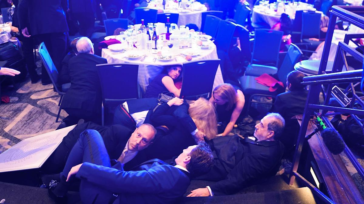 In pictures: Chaos as gunfire heard in Washington DC ballroom