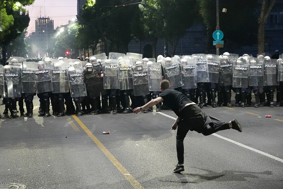 Protesters clash with police after an anti-government rally in Serbia's capital
