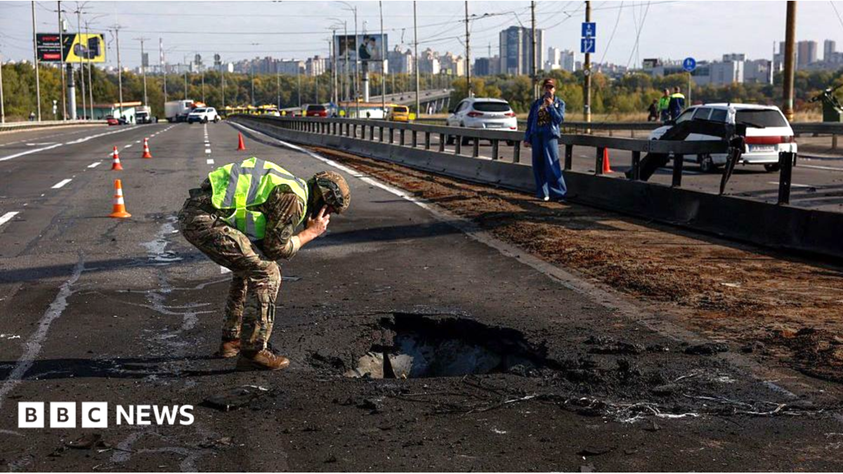 Kyiv bridge hit in further Russian drone attack as German chancellor makes surprise visit