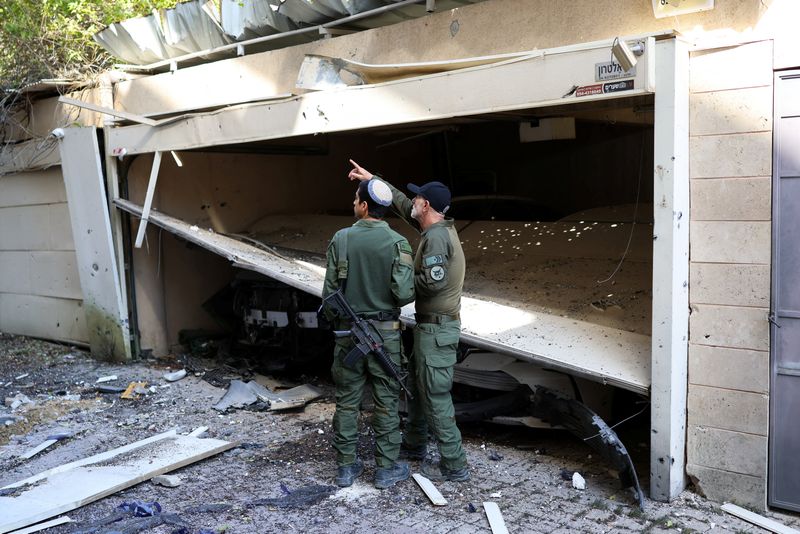 Israeli military says Iranian missiles hit central Israel