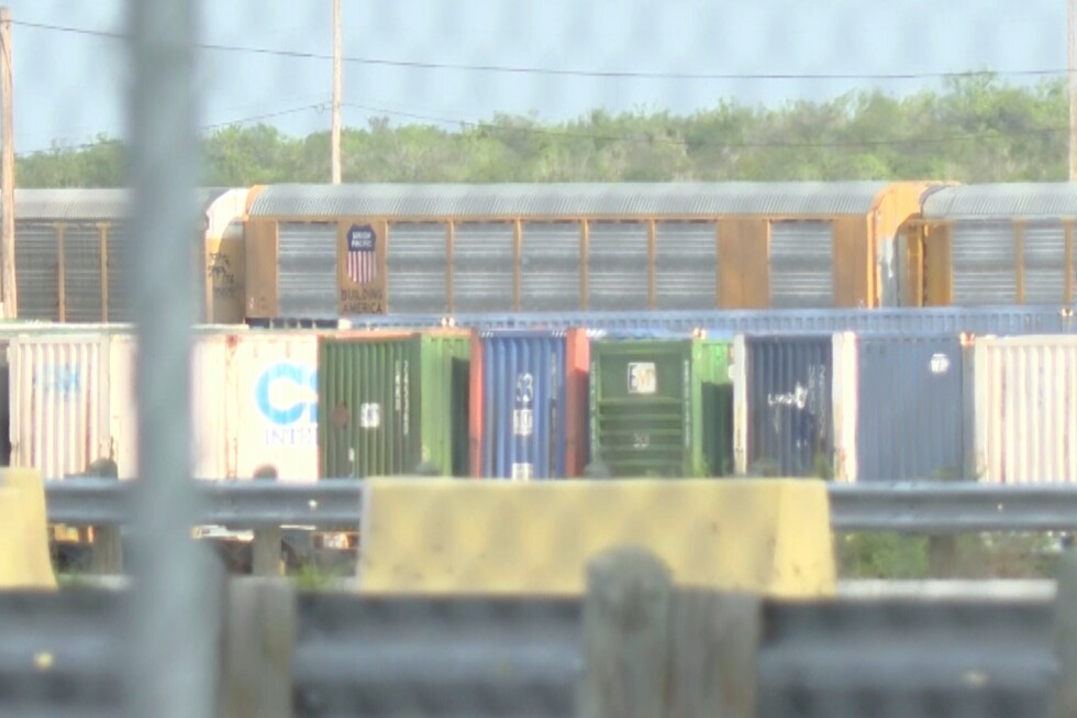 Heat stroke is suspected among 6 found dead in a shipping container at a rail yard near Texas border