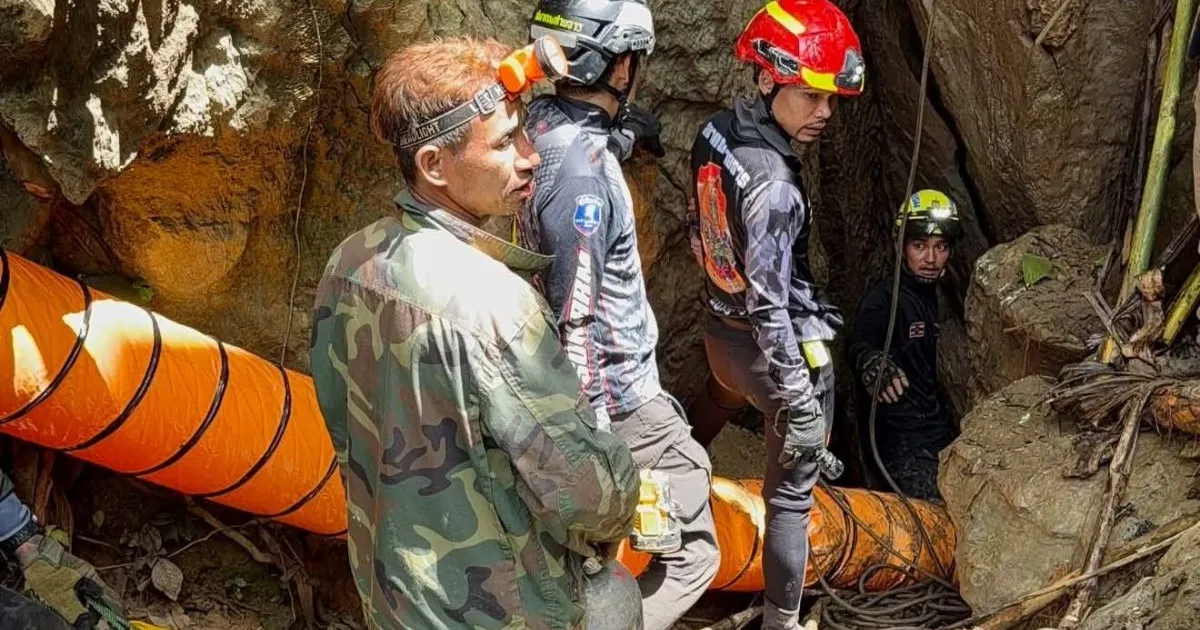 Rescuers race to reach seven trapped in a Laos cave