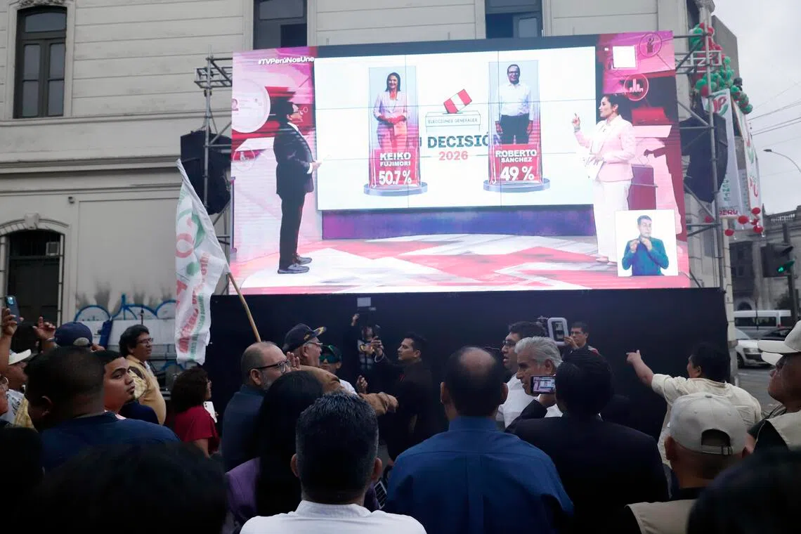 Peru exit polls show Fujimori ahead in ultra-tight presidential run-off
