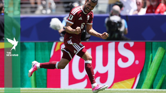 Qatar earn first ever World Cup point with late goal