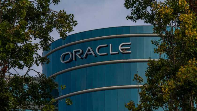 Oracle moves to raise $50B via debt and equity for massive AI data center expansion amid AI spending scrutiny