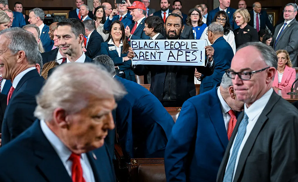 Rep. Al Green Removed From Trump's State of the Union After Protesting With 'Black People Aren't Apes' Sign