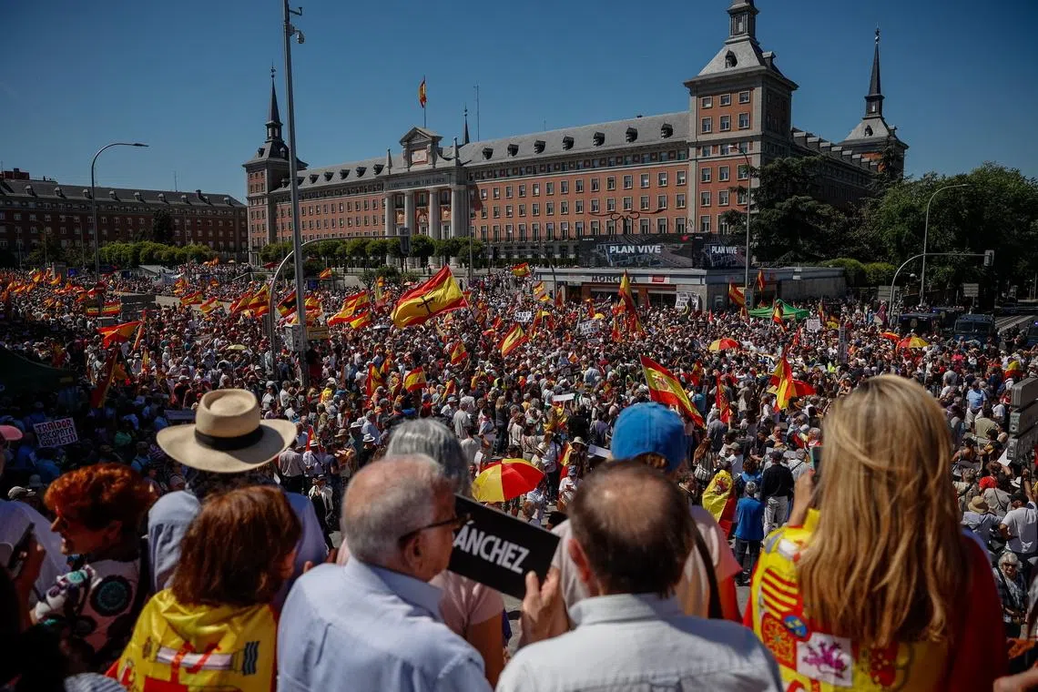 Tens of thousands march in Madrid to demand prime minister’s resignation