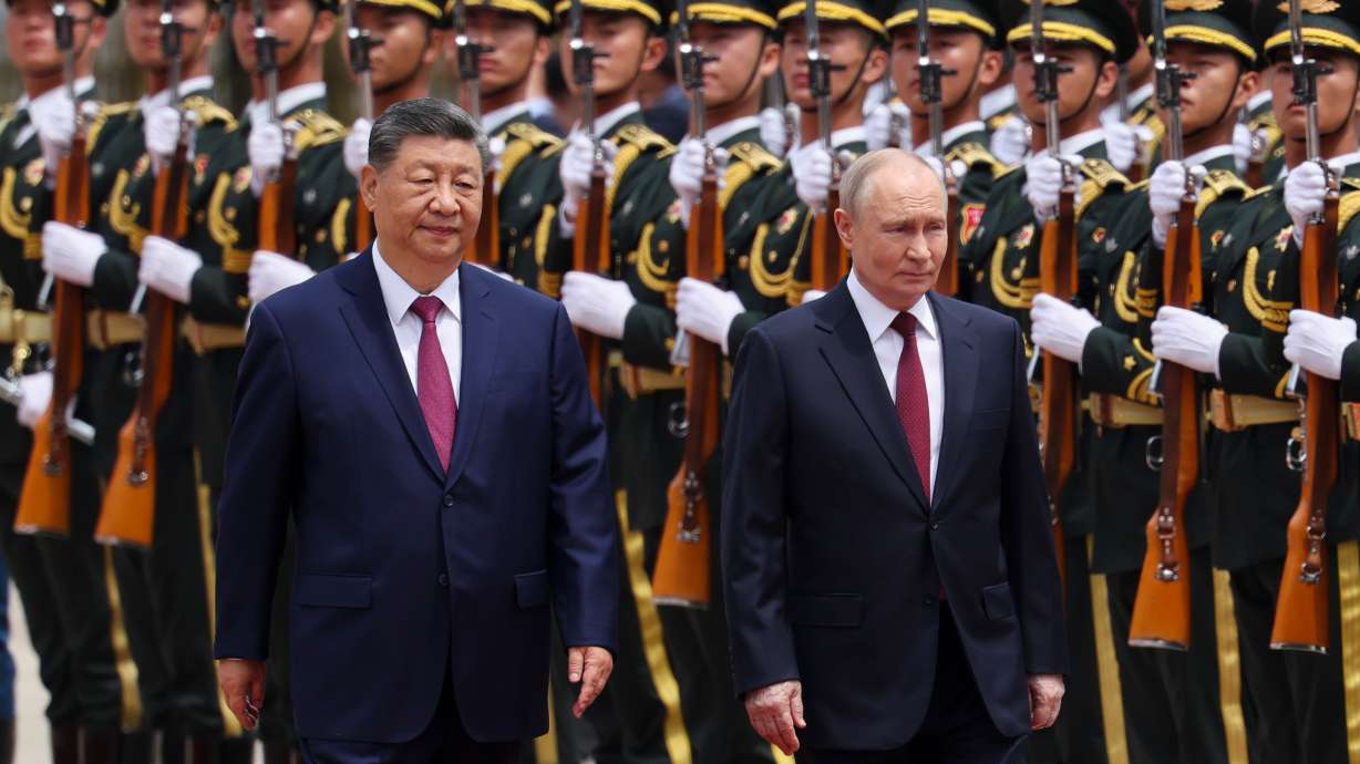 Putin and Xi hail their friendship and growing energy trade at their meeting in Beijing