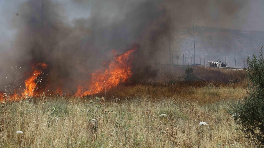 Israeli occupiers set fire to farmland in Christian-majority town in West Bank, mayor says
