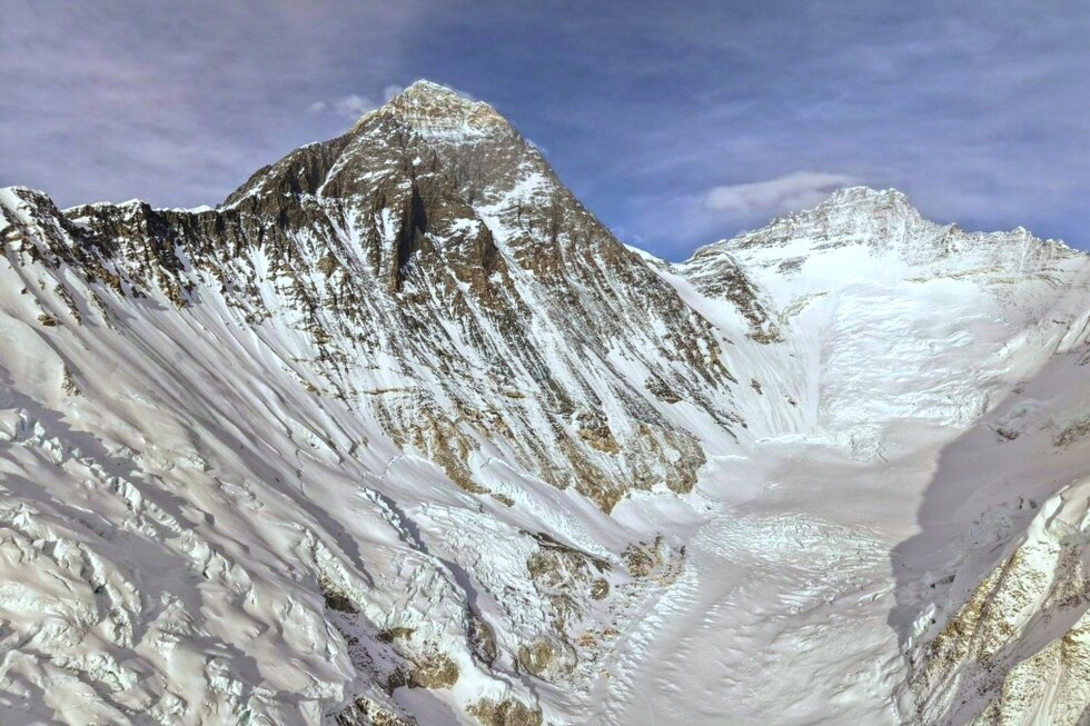 Photos show climbers attempting to scale Mount Everest despite increasing challenges