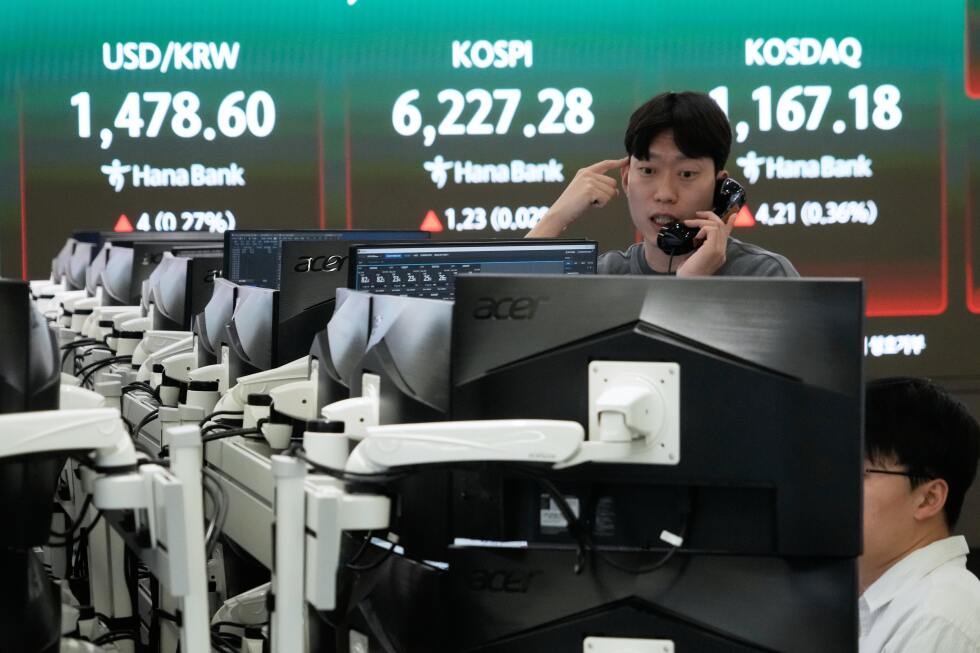Asian stocks lower and oil falls after Wall Street sets another record on ceasefire hopes