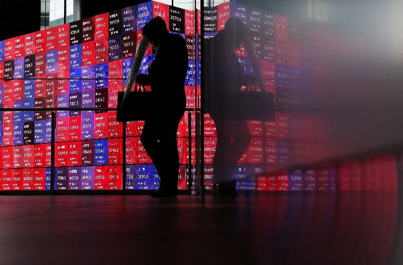 Global stocks skid, bonds buckle as oil climbs