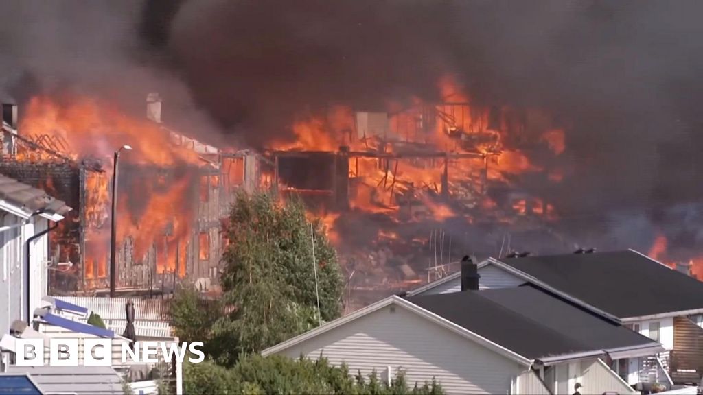 Helicopters dump water as huge Norway fire destroys homes