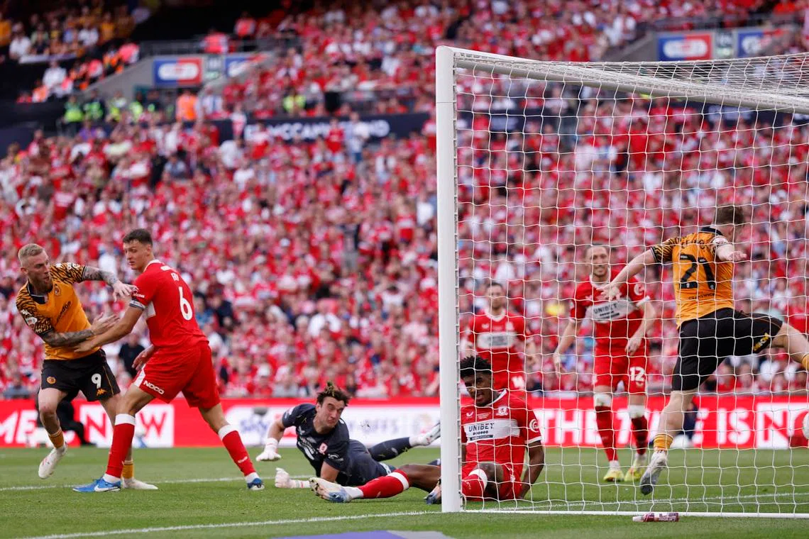Hull back in Premier League after McBurnie's last-gasp playoff winner