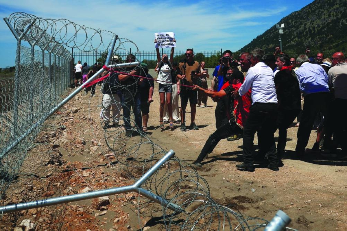 Protesters tear down Albanian development site fences, amid anger over coastal projects