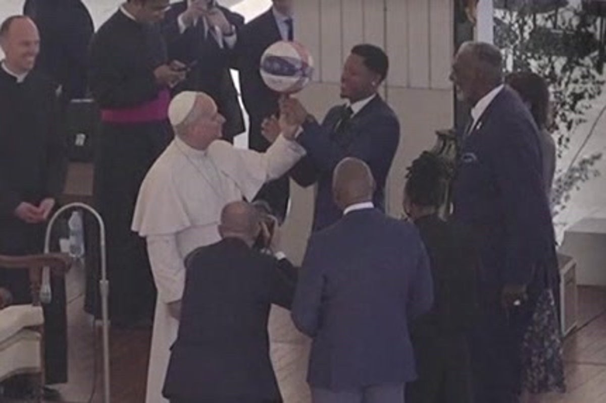 Pope Leo spins basketball on his finger as Harlem Globetrotters teach him classic trick