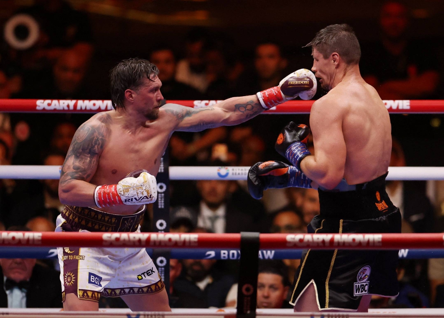 Usyk survives scare from Rico Verhoeven to retain heavyweight titles