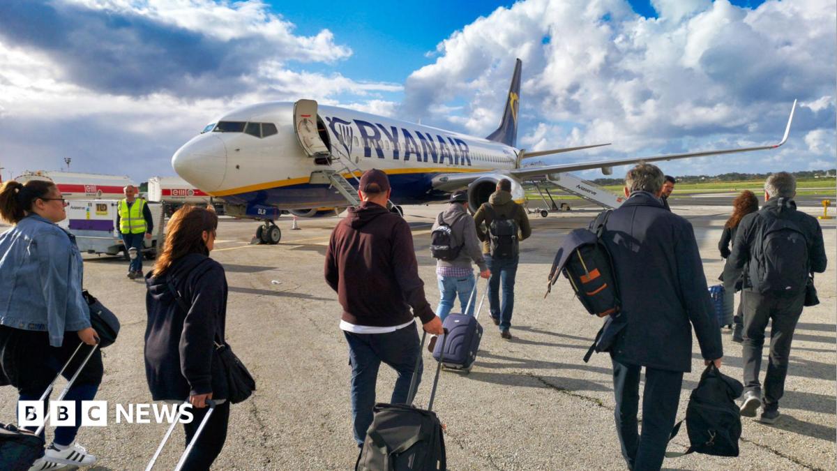 Ryanair says it will reluctantly let parents sit next to children for free