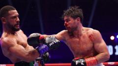 Bloodied Kelly battles past Agyarko to retain title