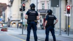 Manhunt after one killed and five injured in Swiss shooting, police say