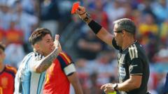 Fernandez defends Argentina as Messi questions remain