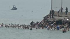 Migrants seen swimming around border fence of Spanish enclave Ceuta