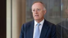 Former Lloyd's of London boss's relationship breached rules, firm says