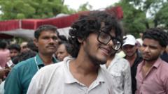 Protesters celebrate resignation of India's education minister