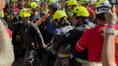 Cheers and applause as security guard rescued from rubble