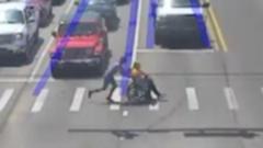 Watch: Driver dressed as Spider-Man whisks man in a wheelchair across busy road