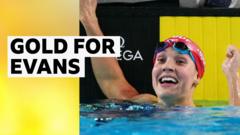 Evans wins breaststroke gold in British record time
