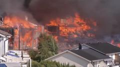 Helicopters dump water as huge Norway fire destroys homes